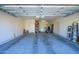 Spacious garage with ample storage and exercise equipment at 10817 W Swayback Pass, Peoria, AZ 85383