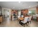 Inviting kitchen featuring stainless appliances, granite countertops, and a table with seating at 10817 W Swayback Pass, Peoria, AZ 85383