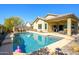 Inviting backyard pool with covered patio, perfect for outdoor entertaining and relaxation at 10817 W Swayback Pass, Peoria, AZ 85383