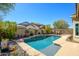 Refreshing pool surrounded by lush landscaping and scenic views at 10817 W Swayback Pass, Peoria, AZ 85383