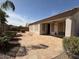 Backyard patio featuring desert landscaping and a covered patio at 11029 W Oraibi Dr, Peoria, AZ 85373