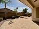 Backyard featuring desert landscaping and a fire pit at 11029 W Oraibi Dr, Peoria, AZ 85373