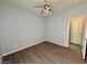 Bedroom with wood-look flooring and a ceiling fan at 11029 W Oraibi Dr, Peoria, AZ 85373