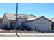 Charming single-story home featuring a two-car garage and manicured desert landscaping at 11029 W Oraibi Dr, Peoria, AZ 85373