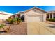 Charming single-story home featuring a two-car garage and desert landscaping for low maintenance appeal at 11029 W Oraibi Dr, Peoria, AZ 85373