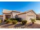 Inviting single-story home with desert landscaping, a two-car garage and a beautiful tile roof at 11029 W Oraibi Dr, Peoria, AZ 85373