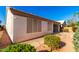 Home exterior featuring stucco walls, a screened patio, and well-maintained landscaping at 11029 W Oraibi Dr, Peoria, AZ 85373