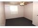 Cozy bedroom with neutral walls, ceiling fan, and carpeted floor at 1209 W 1St Pl, Mesa, AZ 85201