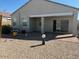 The backyard has a covered patio and low-maintenance landscaping at 1258 E Elaine St, Casa Grande, AZ 85122