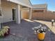 Covered patio area with brick pavers and a block wall for privacy at 1258 E Elaine St, Casa Grande, AZ 85122