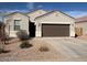 Charming single-story home featuring a well-maintained yard and a two-car garage at 1258 E Elaine St, Casa Grande, AZ 85122