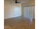 Spacious living room with tile floors and sliding glass door leading to backyard at 1258 E Elaine St, Casa Grande, AZ 85122