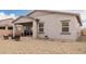 Well-kept backyard features a covered patio and low-maintenance desert landscaping at 13314 W Dale Ln, Peoria, AZ 85383