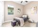 Cozy bedroom featuring a single bed, soft textures, and a bright window at 13314 W Dale Ln, Peoria, AZ 85383