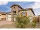 Charming single-story home featuring brick accents, a two-car garage and desert landscaping at 13314 W Dale Ln, Peoria, AZ 85383