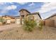 Exterior shot of a single-story home with desert landscaping and a brick-paved driveway at 13314 W Dale Ln, Peoria, AZ 85383