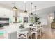 Bright kitchen showcasing a large center island, white cabinets, and stainless steel appliances at 13314 W Dale Ln, Peoria, AZ 85383