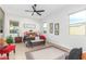 Spacious bedroom featuring neutral decor, ceiling fan, and natural lighting at 13314 W Dale Ln, Peoria, AZ 85383