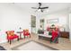 Bright bedroom featuring neutral decor, a ceiling fan, and an ensuite bathroom at 13314 W Dale Ln, Peoria, AZ 85383