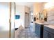 A luxurious bathroom features a double sink vanity, tiled shower, and tiled floors at 13350 W La Reata Ave, Goodyear, AZ 85395