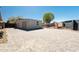 A large driveway leads to a detached garage, with a fenced-in side yard at 13350 W La Reata Ave, Goodyear, AZ 85395