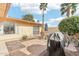 Backyard with pavers, patio furniture, a grill, and a charming bicycle at 13354 W Stonebrook Dr, Sun City West, AZ 85375