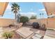 Backyard featuring pavers, a grill, patio furniture, a bicycle, and a shade umbrella at 13354 W Stonebrook Dr, Sun City West, AZ 85375