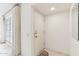 Bright entryway featuring a white door, tile flooring, neutral walls, and a window for natural light at 13354 W Stonebrook Dr, Sun City West, AZ 85375