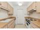 This is a standard kitchen featuring a sink, appliances and counter space at 13354 W Stonebrook Dr, Sun City West, AZ 85375