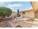 Back patio area with paver stones, a shade umbrella, and a tree at 13354 W Stonebrook Dr, Sun City West, AZ 85375