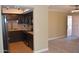 Well-lit kitchen with modern appliances adjacent to an open living area at 1340 N Recker Rd # 254, Mesa, AZ 85205