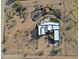 A birds-eye view of the property showing the home layout, desert landscaping, and outdoor living spaces at 13935 E Smokehouse Trl, Scottsdale, AZ 85262