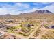 Aerial shot highlighting the property's boundaries, surrounding desert landscape, and mountain views at 13935 E Smokehouse Trl, Scottsdale, AZ 85262