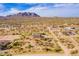 Aerial shot highlighting the property's boundaries, surrounding desert landscape, and mountain views at 13935 E Smokehouse Trl, Scottsdale, AZ 85262