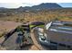 Scenic aerial view of the property showing desert landscaping, modern home design, and outdoor spaces at 13935 E Smokehouse Trl, Scottsdale, AZ 85262