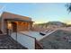 Exterior backyard featuring a stucco home and lounge chairs on a patio at 13935 E Smokehouse Trl, Scottsdale, AZ 85262