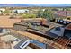 Overhead view of an outdoor kitchen, dining area, and metal art sculptures in a desert landscaped backyard at 13935 E Smokehouse Trl, Scottsdale, AZ 85262