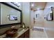 Bathroom featuring a vessel sink, granite counters, and a shower with tile at 13935 E Smokehouse Trl, Scottsdale, AZ 85262