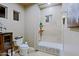 Bathroom features a shower over tub combination with beige tile at 13935 E Smokehouse Trl, Scottsdale, AZ 85262