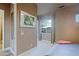 Cozy bedroom features neutral tones, carpet, and a large window providing natural light and views at 13935 E Smokehouse Trl, Scottsdale, AZ 85262