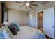 Bedroom features a king bed, neutral walls and a ceiling fan at 13935 E Smokehouse Trl, Scottsdale, AZ 85262