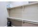 Empty closet featuring shelving, hanging rods and wood floors at 13935 E Smokehouse Trl, Scottsdale, AZ 85262