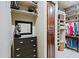 Walk-in closet with custom shelving and drawers at 13935 E Smokehouse Trl, Scottsdale, AZ 85262