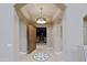 Elegant foyer with decorative tile flooring, arched doorways, and a view of the outdoor gate at 13935 E Smokehouse Trl, Scottsdale, AZ 85262