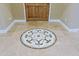 Elegant foyer featuring decorative tile flooring and wooden door with beige walls at 13935 E Smokehouse Trl, Scottsdale, AZ 85262