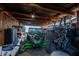 Open garage featuring a black all terrain vehicle with a view of the yard at 13935 E Smokehouse Trl, Scottsdale, AZ 85262