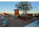 Outdoor dining area with windmill, desert landscape, and a rustic, ranch-style design at 13935 E Smokehouse Trl, Scottsdale, AZ 85262