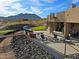 Spacious patio with desert landscaping, spiral staircase, and comfortable seating, creating an inviting outdoor living space at 13935 E Smokehouse Trl, Scottsdale, AZ 85262