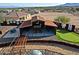 Aerial shot showcases the outdoor recreation area, custom structure, and desert landscaping, ideal for entertaining at 13935 E Smokehouse Trl, Scottsdale, AZ 85262