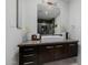 Bathroom vanity featuring vessel sink, contemporary fixtures, and marble backsplash at 1755 W Lawrence Ln, Phoenix, AZ 85021